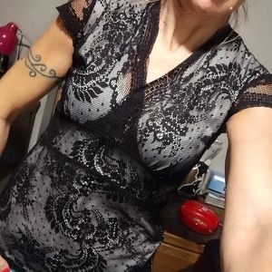 Black lace over white blouse